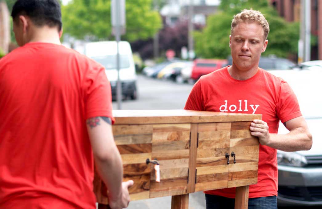 2 Taskrabbit Delivery Helpers lifting a credenza