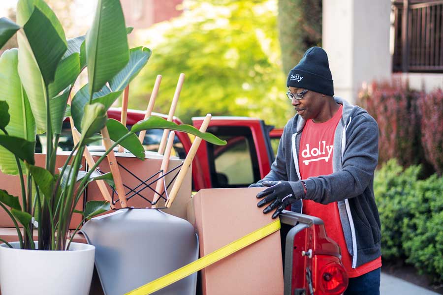A Taskrabbit Delivery Helper unloading a pickup truck
